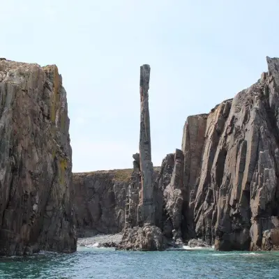 a rocky island in the middle of a large rock