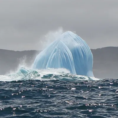 a person riding a wave on top of a body of water