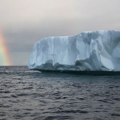 a rainbow over a body of water